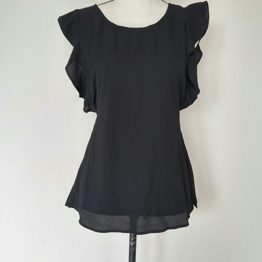 Ruffle cap sleeves and a high neck printed blouse.